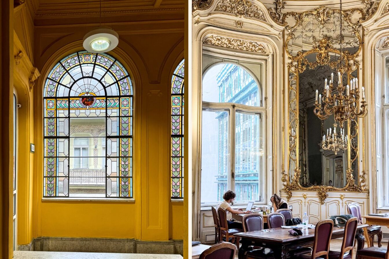 Einblick in die prunkvolle Metropolitan Ervin Szabó Bücherei in Budapest. Links im Bild: buntes Jugendstilfenster in einem sonnig gelben Treppenhaus. Rechts im Bild: historischer Lesesaal mit vergoldetem Stuck, prächtigem Spiegel und Kronleuchter im Stil des 19. Jahrhunderts. Menschen sitzen an alten Holztischen und arbeiten am Laptop – eine eindrucksvolle Verbindung aus Geschichte und Gegenwart.