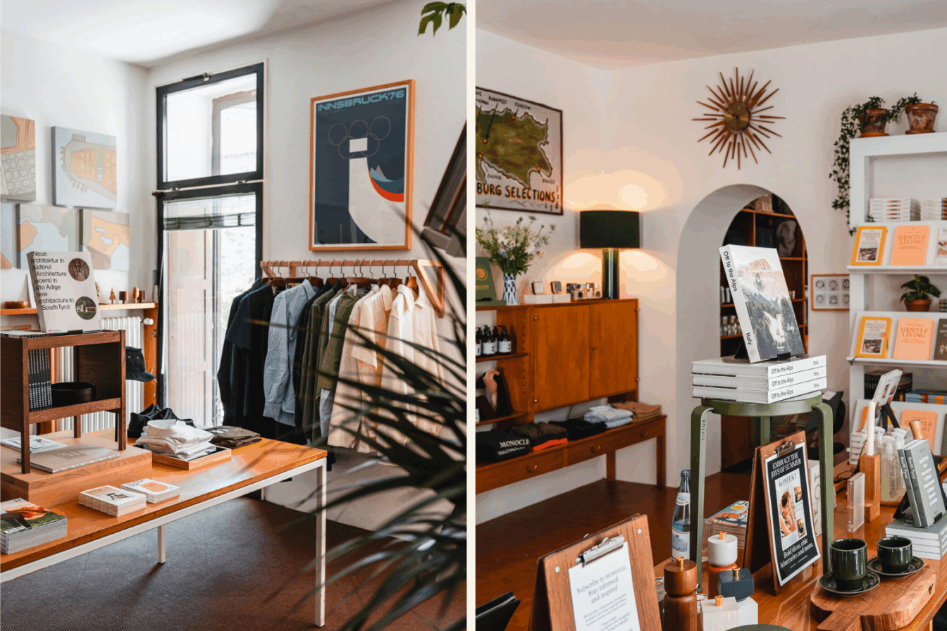 Eine helle Geschäftfläche mit Büchern, Magazinen, Pflanzen, Postern und Möbeln aus Holz.