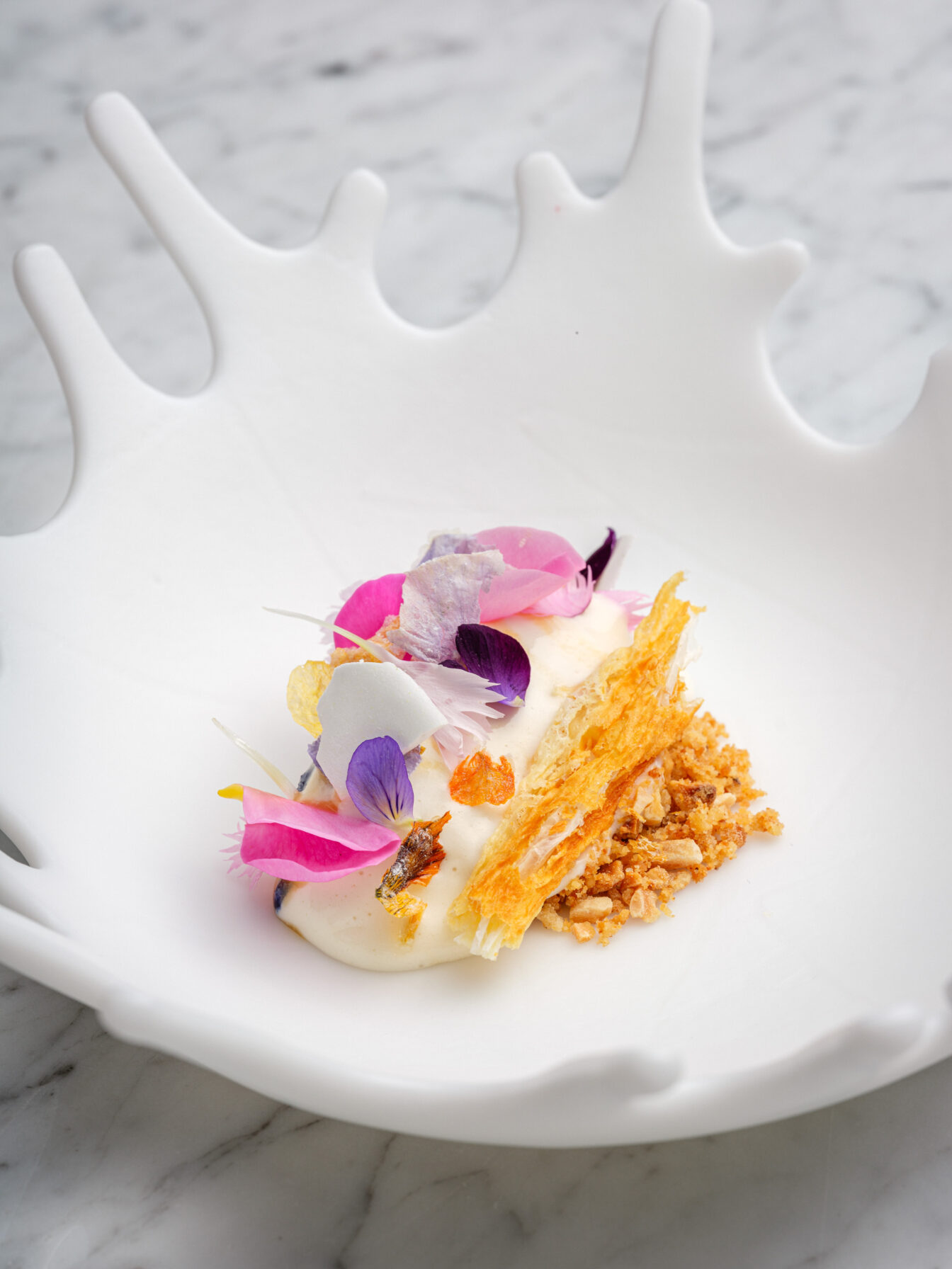 buntes Gericht aus dem Restaurant Glasswing in Wien