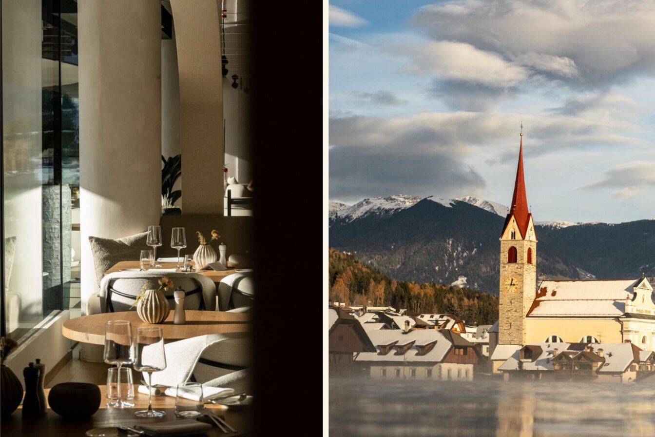Modernes Restaurant im Winkler Hotel Solvie im Pustertal, Südtirol, und Ausblick auf ein winterliches Dorf mit Kirchturm und Bergpanorama.